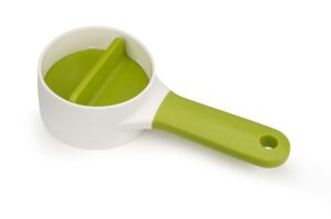 Compact vegetable spiralizer in green with long handle and finger guard by Joseph Joseph