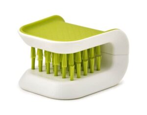 Safe knife cleaning brush in grey from Joseph Joseph with wrap-around bristle design