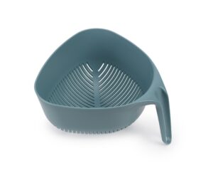 Triangular kitchen colander in dark opal by Joseph Joseph with vertical ergonomic handle