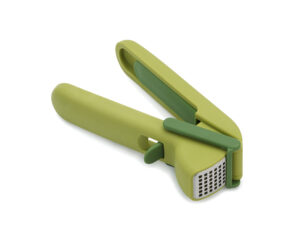 Easy clean garlic press in green from Joseph Joseph with trigger wiper and built-in cleaning tool