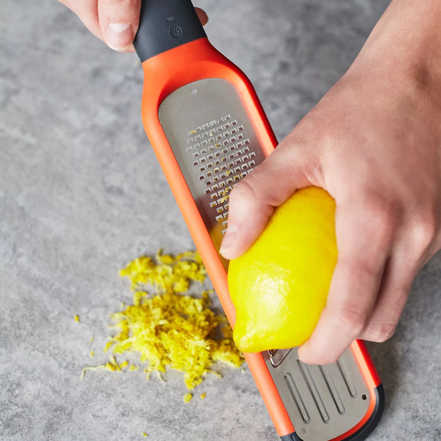 Joseph Joseph Handi-Grate 2-in-1 Mini Grater and Slicer in orange